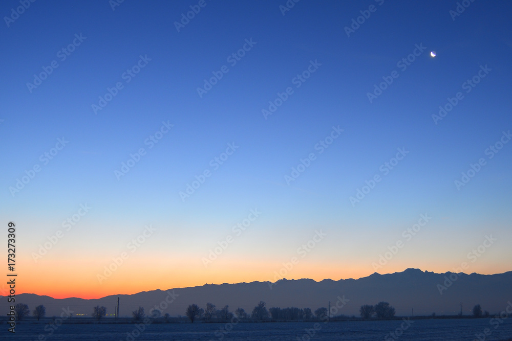 Sunrise on a clear winter morning with mountains