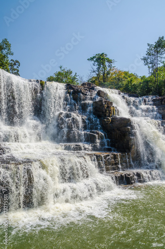 Beautiful Sala water falls near Labe with trees, green pool and a lot of water flow, Guinea Conakry, West Africa photo