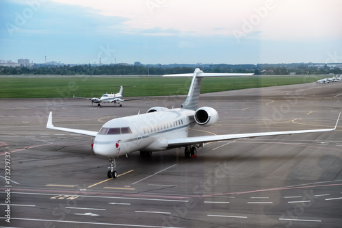 Modern plane in big city airport