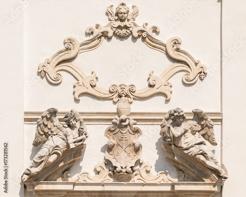 Stone angels on the facade of a medieval church.