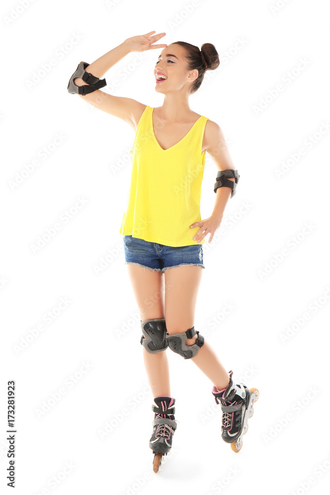 Beautiful young woman on roller skates against white background Beautiful young woman on roller skates against white background