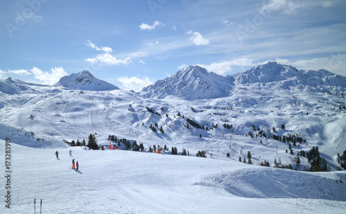 Wide snowy slopes in high mountains in La Plagne ski resort, Alps, France