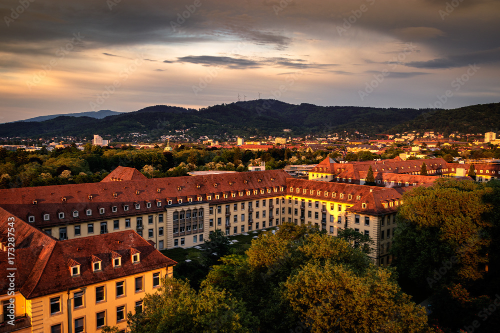 Sunset over Freiburg im Breisgau with the black forest in the background.