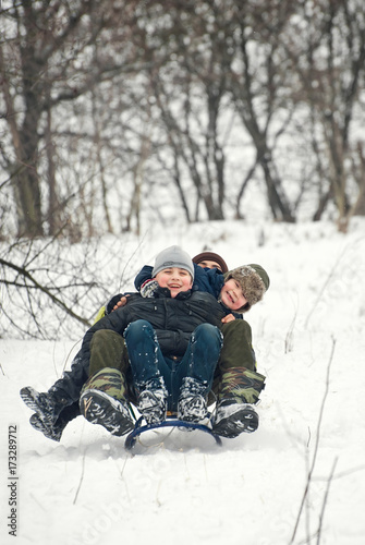 children sled in winter in fresh air