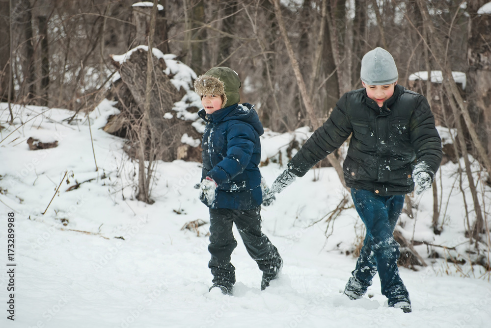 the guys are playing in the snow in the winter