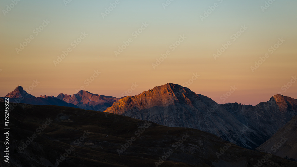 Colorful sunlight on the majestic mountain peaks and ridges of the Alps.