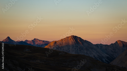 Colorful sunlight on the majestic mountain peaks and ridges of the Alps.