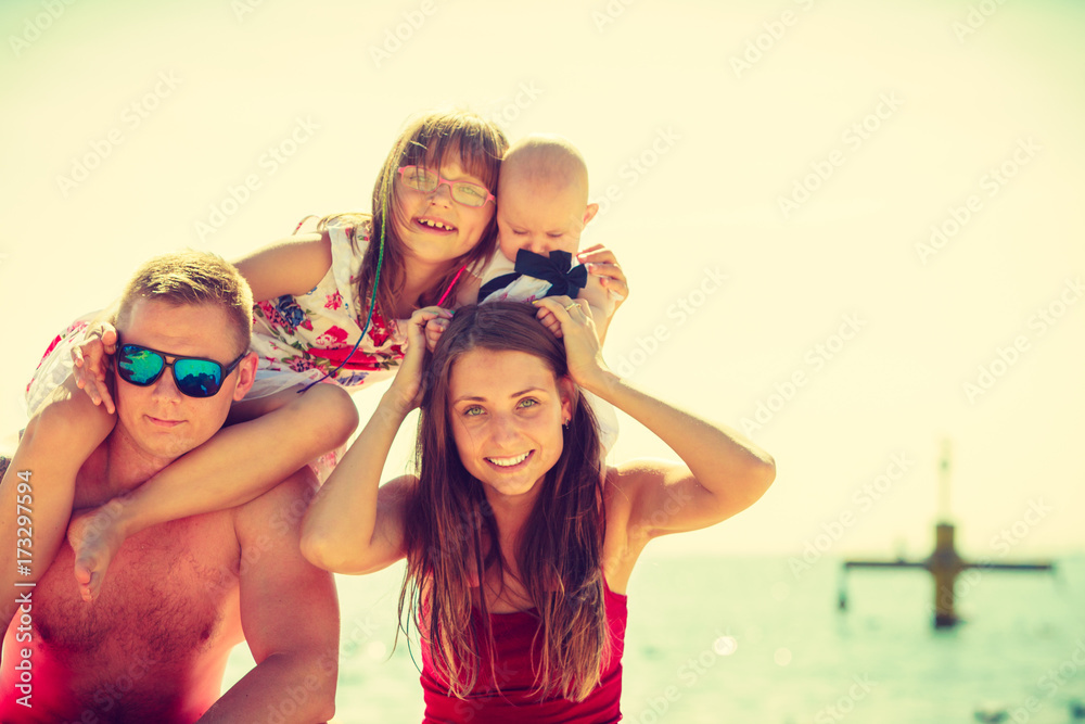 Family posing at beach near sea