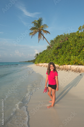 Smiling little girl in a tropical beach © inigocia