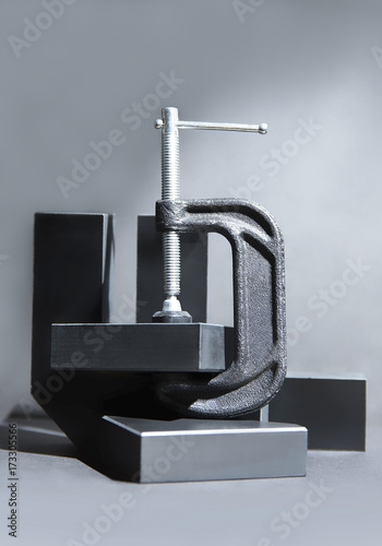 Clamp with Blocks on Gray Background