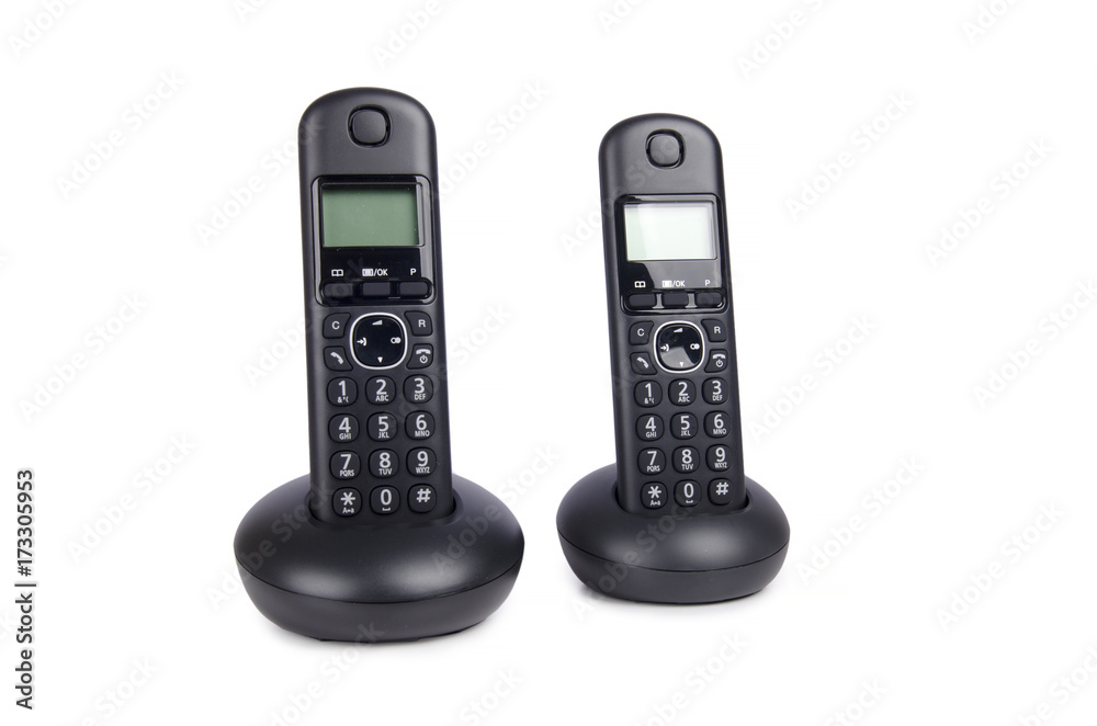 Modern cordless dect phone with charging station and display on isolated on white background Modern cordless dect phone with charging station and display on isolated on white background