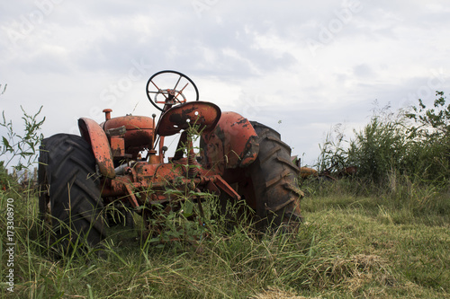 rusted antique farm tractor machinery