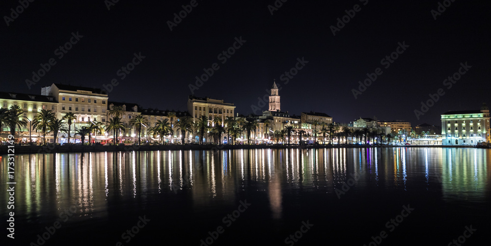 Split Riva at Night from the Harbor - Diocletian's Palace and the Riva with lights reflected on the river.