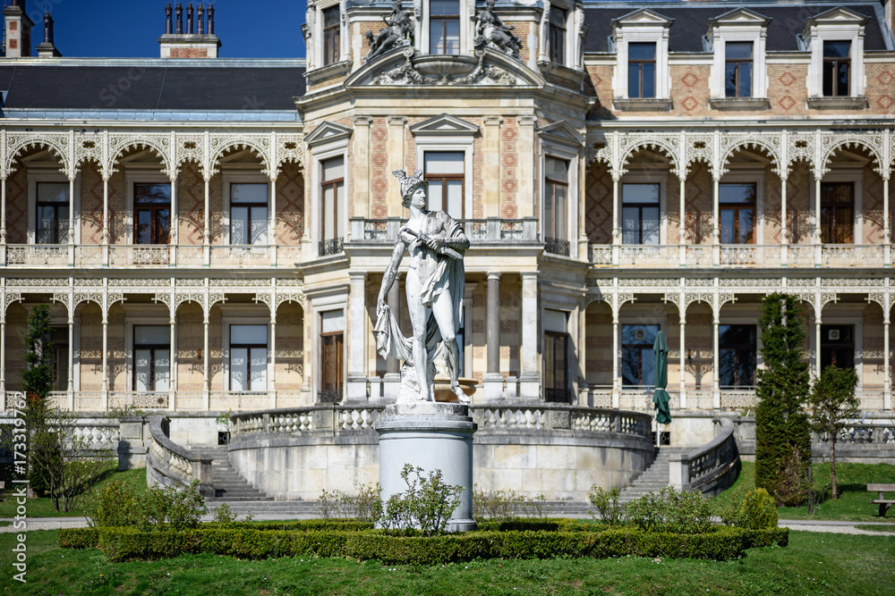 Palace Hermesvilla with the marble statue of Hermes in front of it in the wildlife preserve Lainzer Tiergarten, in Vienna, Austria.