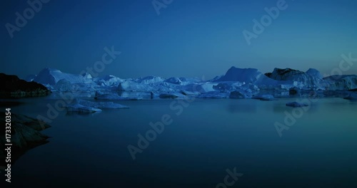 Icebergs floating in Disko bay in Greenland photo