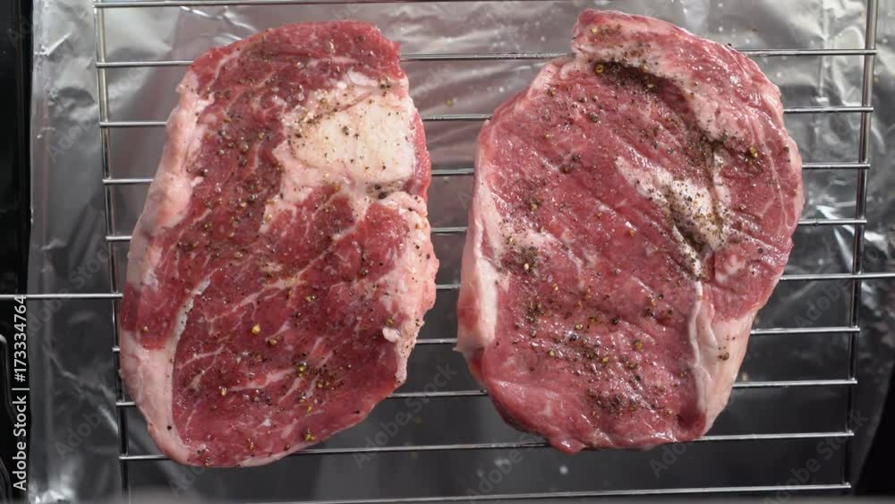 Vidéo Stock Cooking grilled steak ribeye in the oven with broiler. View