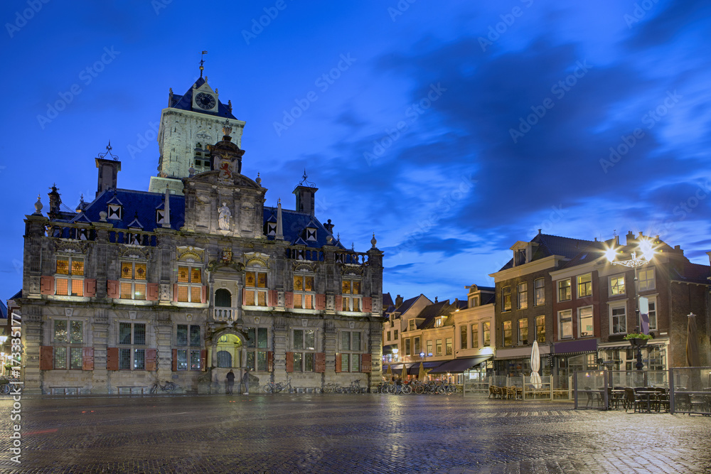 Travel Concepts and Ideas. Stadhuis (Known as City Hall) at Local Markt Square (Market Place)  in Dutch Old City Delft during Blue Hour, in Holland, the Netherlands