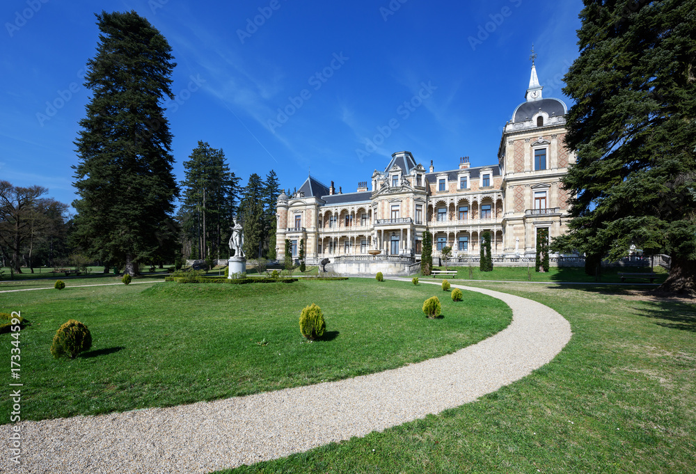 Palace Hermesvilla with the marble statue of Hermes in front of it in the wildlife preserve Lainzer Tiergarten, in Vienna, Austria.