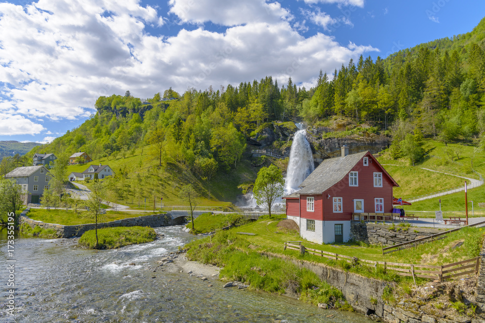 Splendid summer view with popular waterfall Steinsdalsfossen on the Fosselva River Splendid summer view with popular waterfall Steinsdalsfossen on the Fosselva River