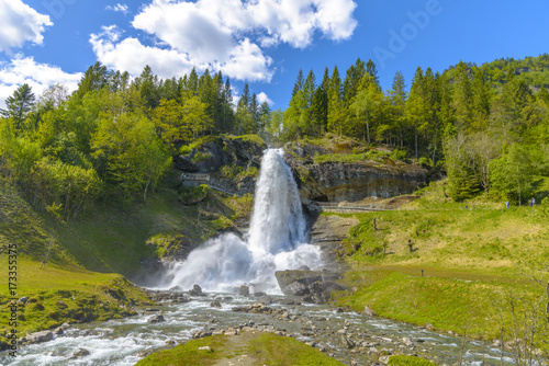 Splendid summer view with popular waterfall Steinsdalsfossen on the Fosselva River