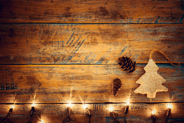 Christmas lights bulb with decoration on wood table. Merry christmas (xmas) background. topview, border design - rustic and vintage styles