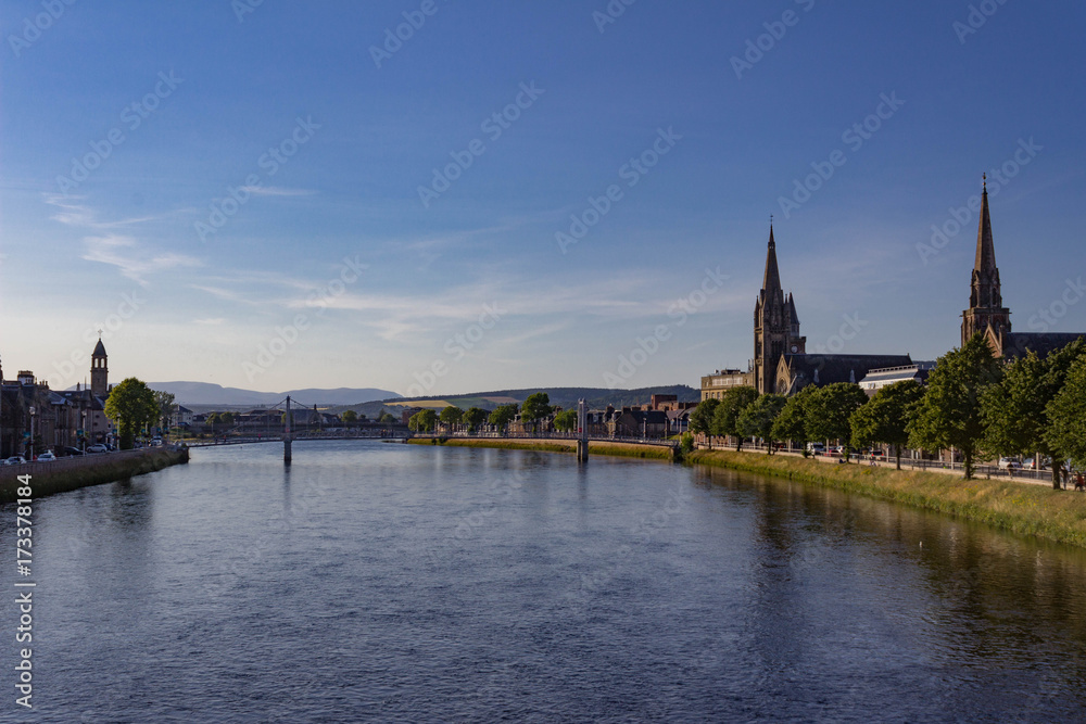 Beautiful dusk view of Panorama of Inverness looking downstream to the Greig St Bridge with Huntly Street on the left, the River Ness cutting between and Bank Street on the right.