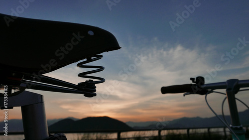 The silhouette of vintage bicycle and sunset