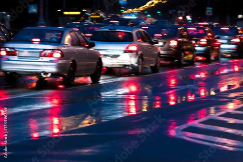 blurry image of city traffic during evening rush hour on wet road © Mr Twister