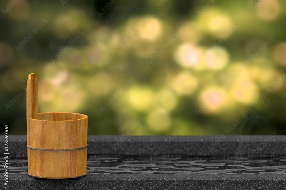3D rendering. Japanese wood bath bowl on Hot spring bathtub or onsen with blurred green forest bokeh as background 3D rendering. Japanese wood bath bowl on Hot spring bathtub or onsen with blurred green forest bokeh as background