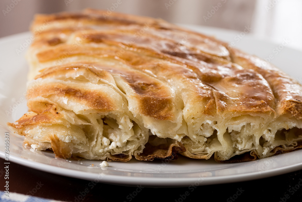 Closeup macro of balkan burek with cheese on the plate