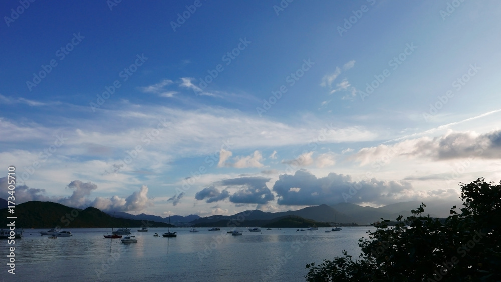 Boat, lake, mountain, blue sky and clouds