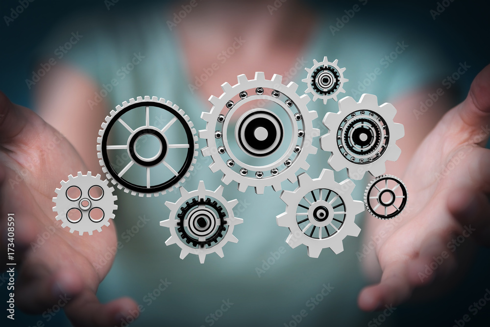 Businesswoman using floating gear icons 3D rendering Businesswoman using floating gear icons 3D rendering