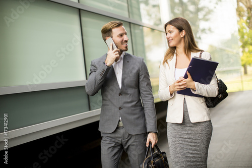Business couple walking and...