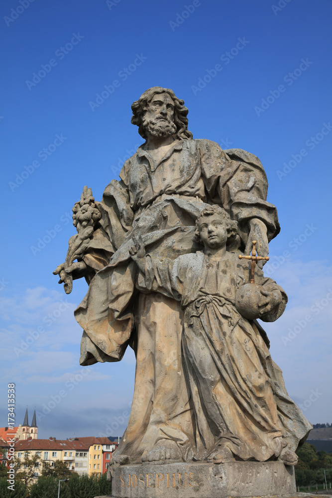 Baroque Statue of Saint of Josephus on old Main Bridge in Wurzburg. Franconia. Germany