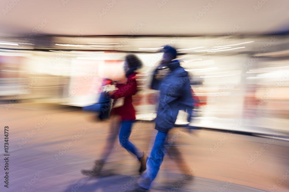 Shopper walking in front of shop window