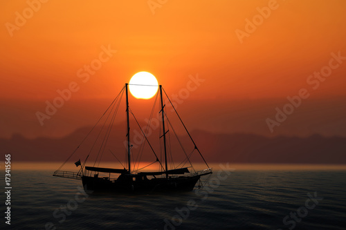 Sailing boat in the sea with red sky sunset