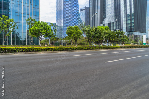 empty asphalt road front of modern buildings.