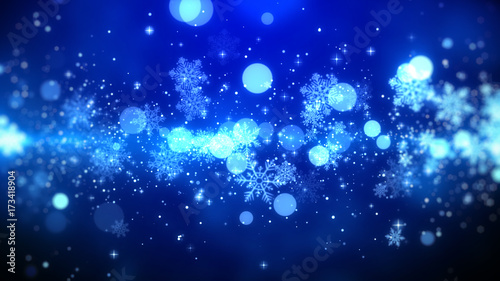 Blue bokeh and snowflakes lights on blue background with Christmas theme. © StockGood