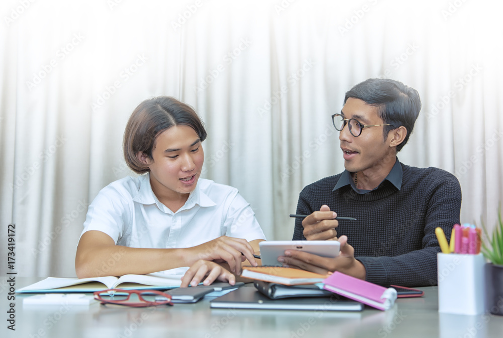 Teenage Boy Studying With Home Tutor. Teenage Boy Studying With Home Tutor.
