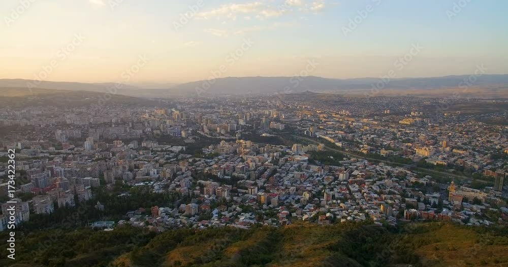 panorama of big city among mountains at summer day aerial view panorama of big city among mountains at summer day aerial view