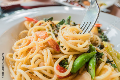 closeup Spaghetti with Cutlery on white plate . Italian food .