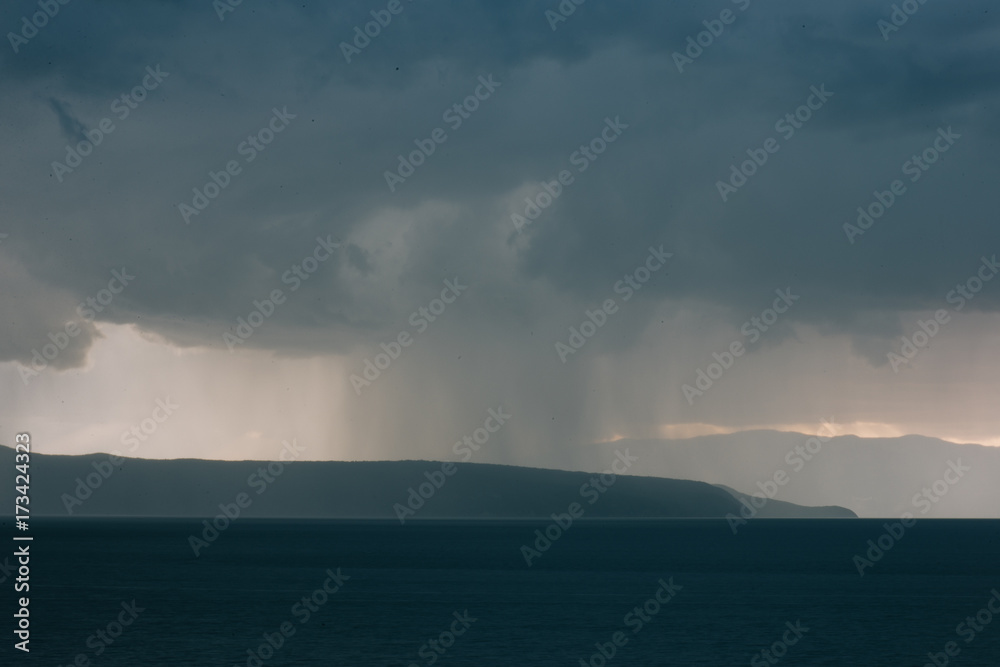 Sunset and stormy clouds over the sea