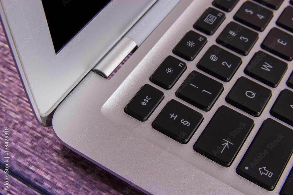 Modern laptop computer on dark background. Modern laptop computer on dark background.