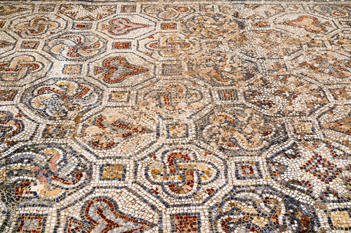 Close-up of ancient mosaic on the street of Roman Archaeological site of Ephesus in Turkey.