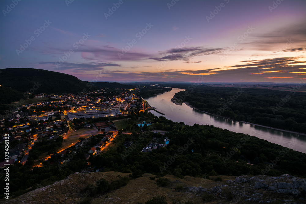 View on small city along river Danube after sunset, Hainburg der donau, Austria