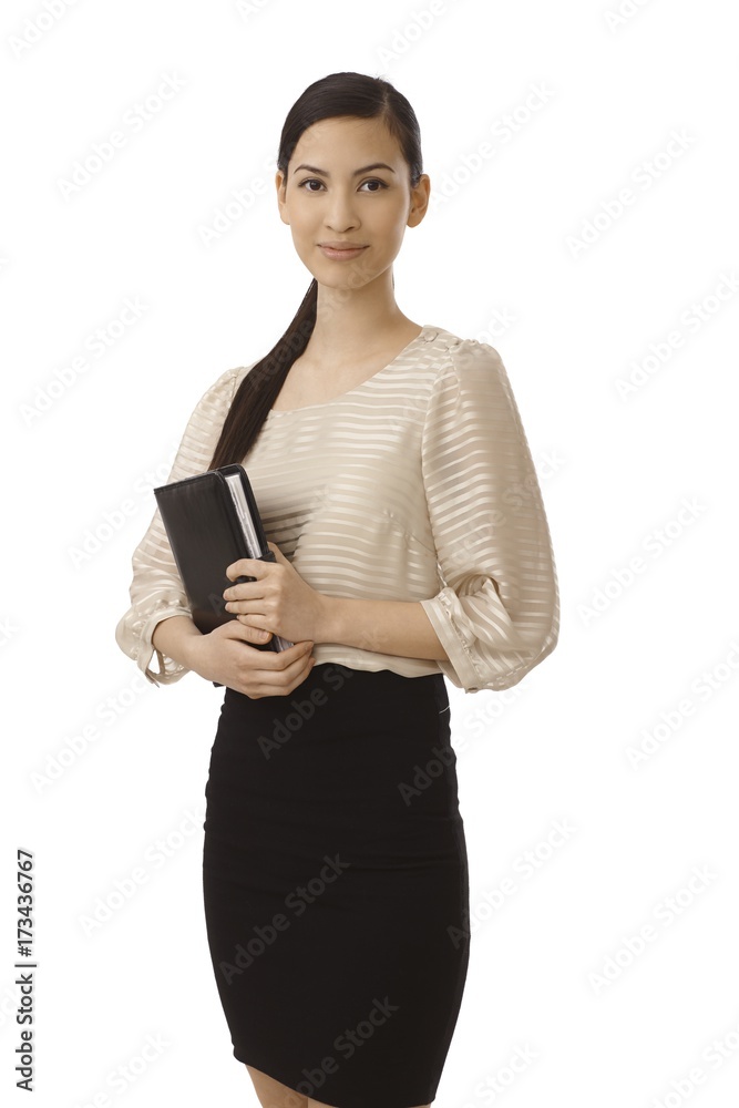 Pretty businesswoman holding personal organizer Pretty businesswoman holding personal organizer
