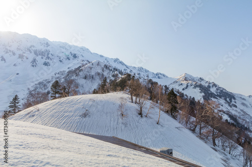  The snow mountains of Tateyama Kurobe alpine with blue sky background is one of the most important and popular natural place in Toyama Prefecture, Japan.