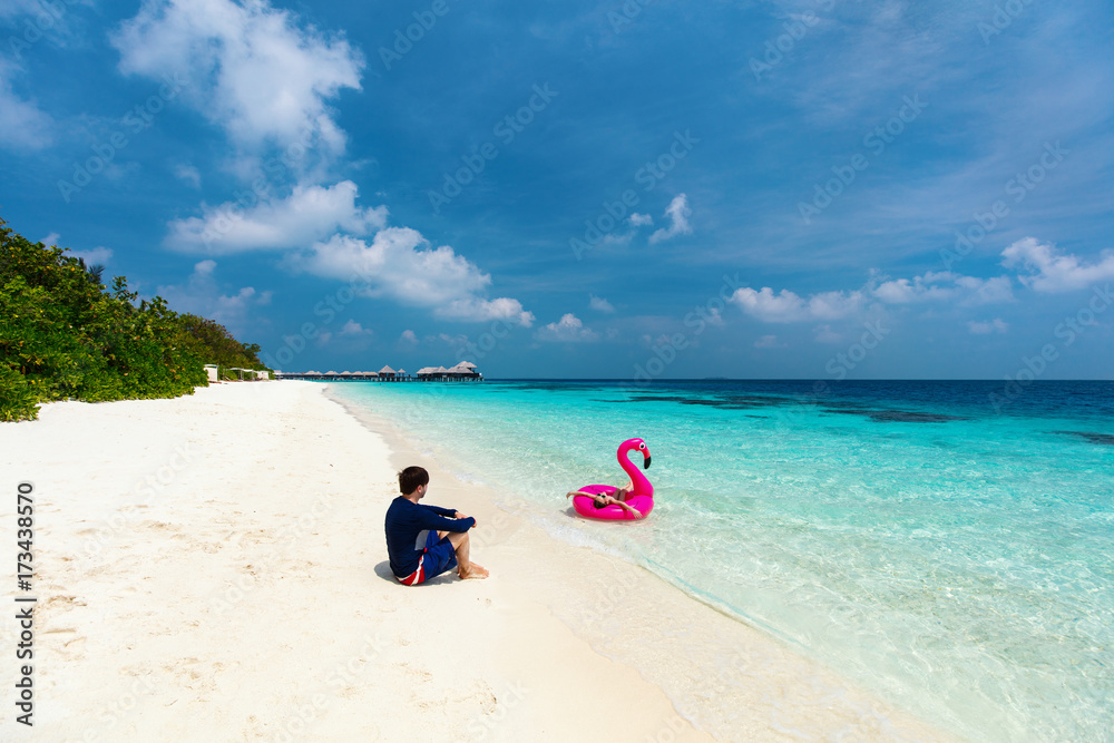 Father with daughter at beach