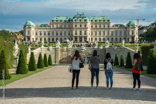 editorial - young tourists admire amazing palace in center city Vienna, Austria, Europe  photo