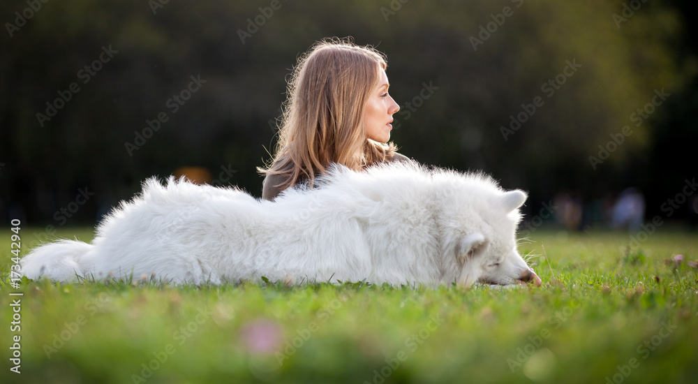 Pretty girl with dog on grass Pretty girl with dog on grass